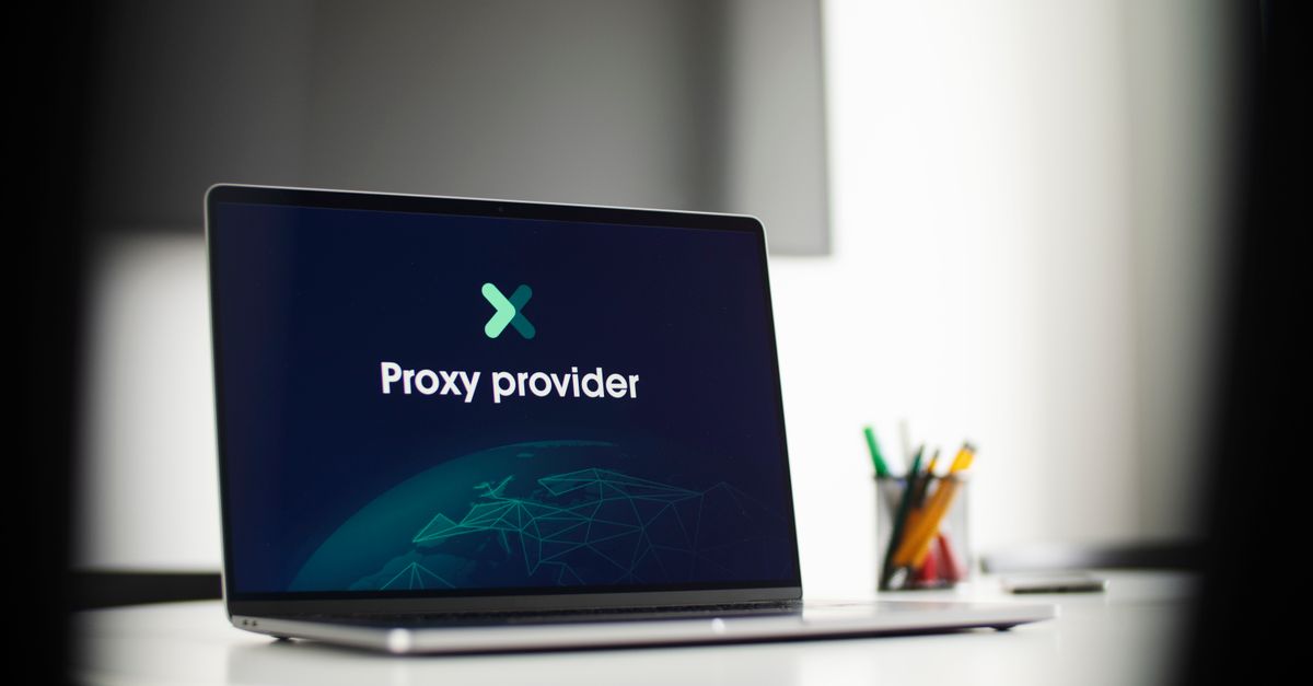 Laptop screen showing 'Proxy provider' in a tech office setting, focus on cybersecurity.